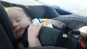 baby sleeping in car seat