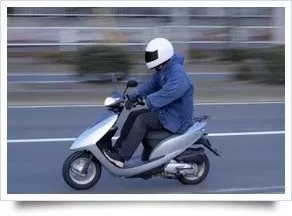 person riding a scooter