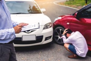A car accident adjuster reporting to an accident