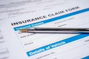 Image of car insurance company claims report
